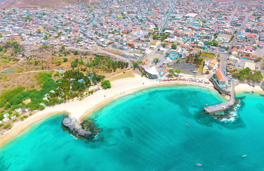 Tarrafal bay on Santiago from the air, green headland above turquoise water